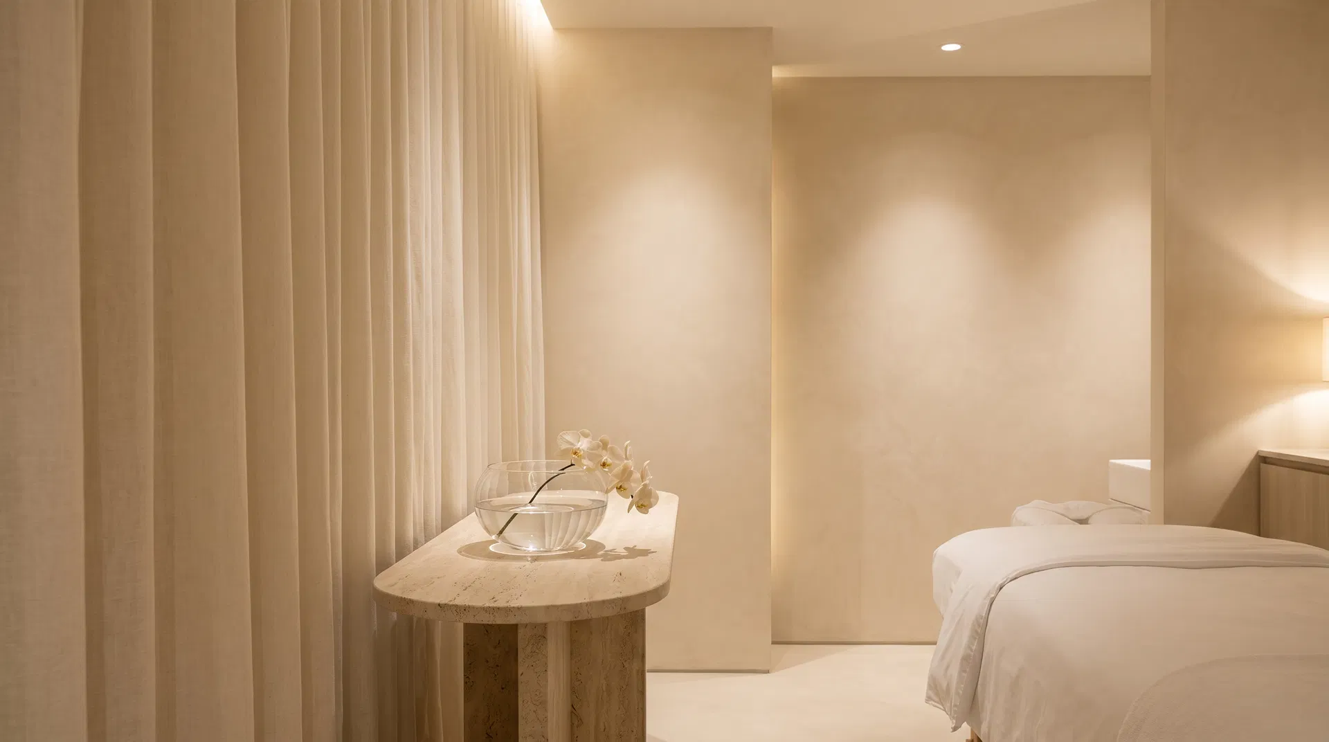 Happy Bubbles Skin treatment suite in Las Vegas, warm ivory surfaces and soft light